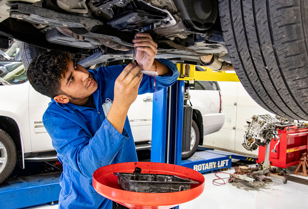 Student working on a car